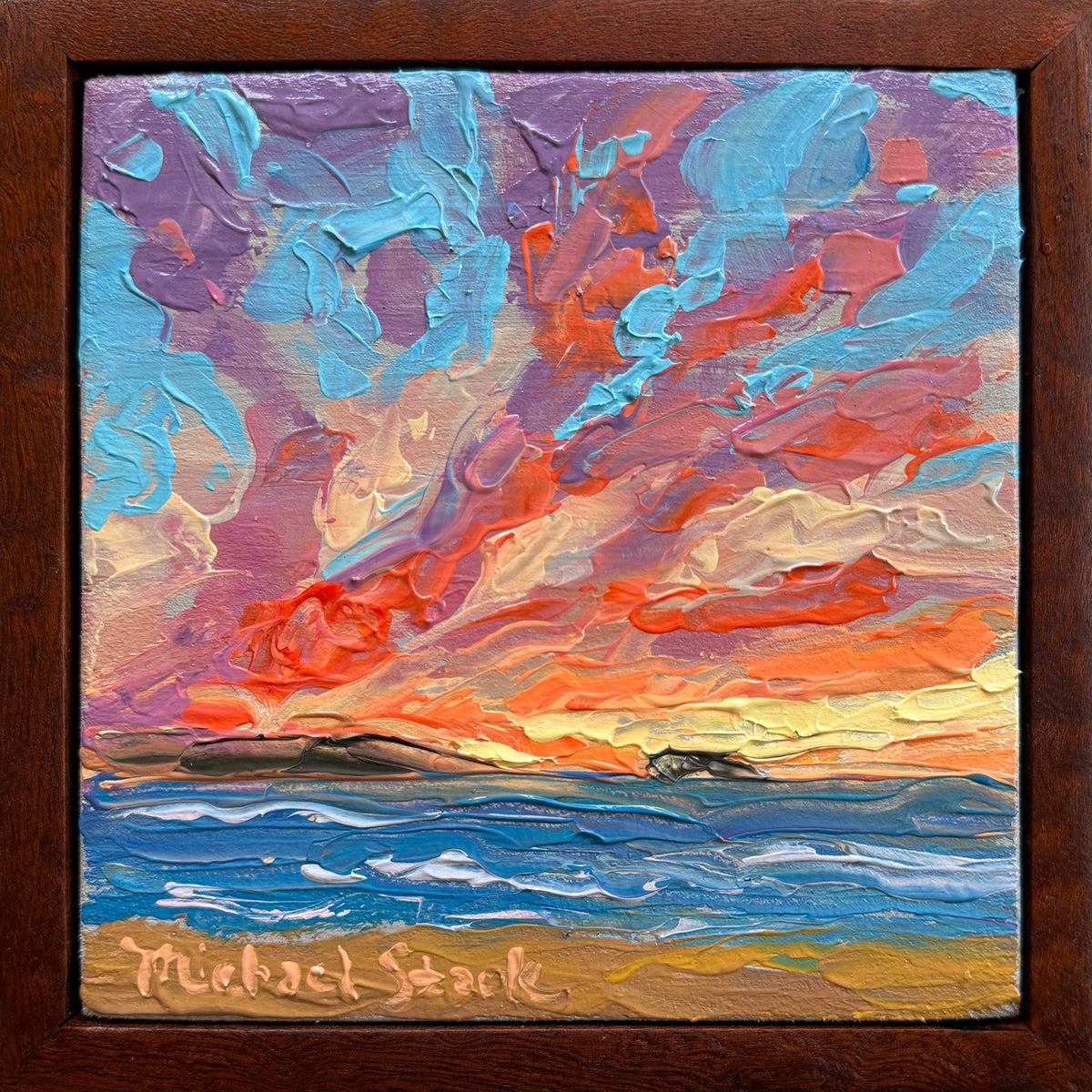 A framed square painting of a dramatic Hawaiian sunset over the ocean, with thick impasto brushstrokes in blue, purple, orange, red, and yellow, plus a visible signature at the bottom that reads Michael Stark.